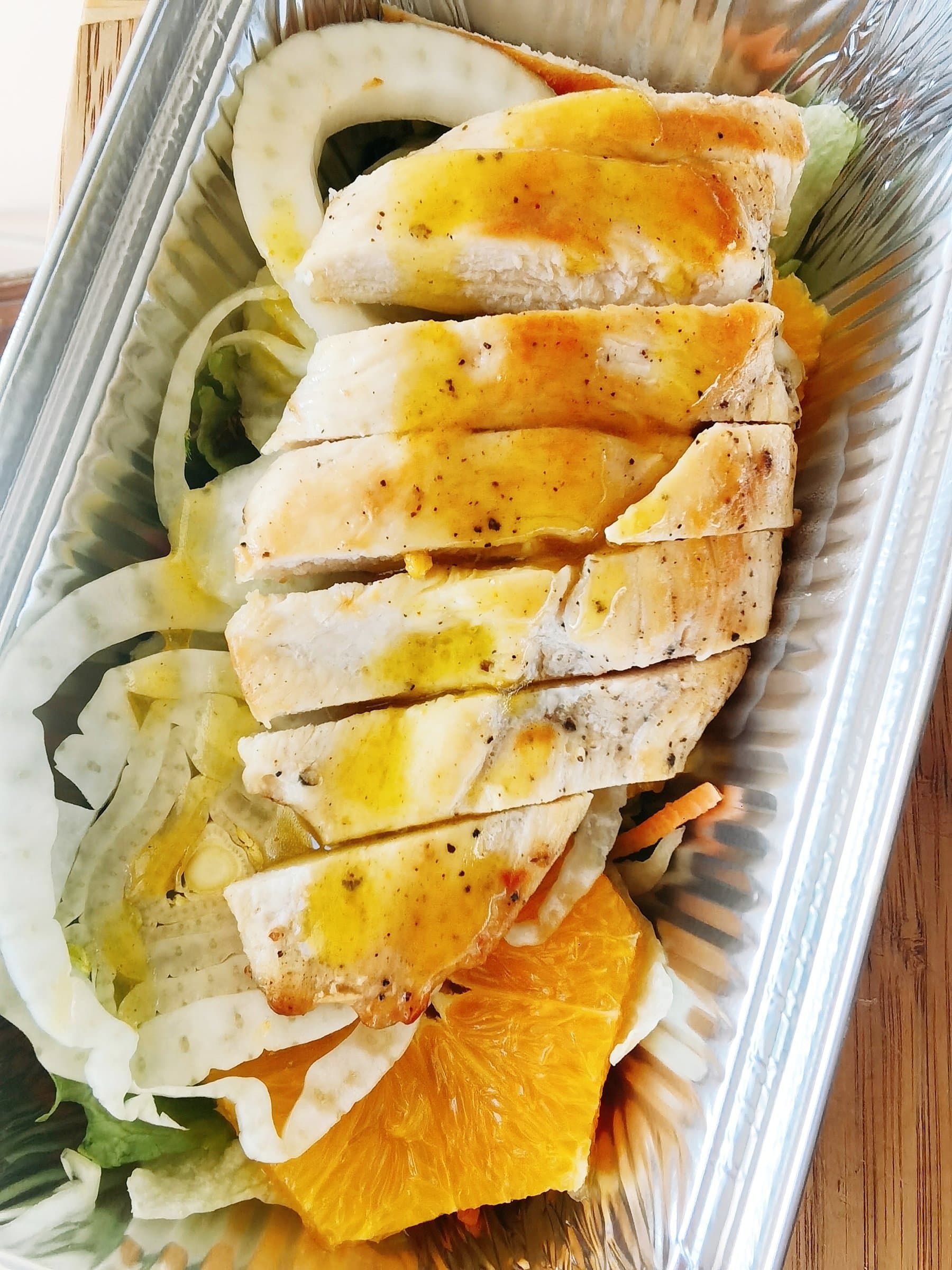 Sliced chicken with a fennel and orange salad, part of the Mediterranean sample menu